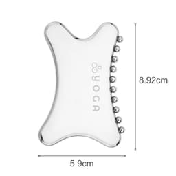 A transparent Gua Sha tool in a unique shape, featuring small rounded edges and a branding logo.