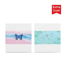 Two decorative notepads featuring a blue butterfly on a pink beach scene and a dragonfly on a green water background.