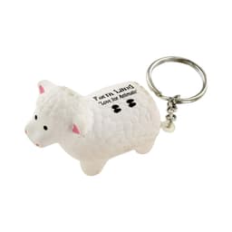 A white sheep stress reliever keyring with a silver keychain attachment. It features a textured surface and a branding logo.