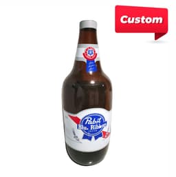 A large inflatable drink bottle in brown, red, white, and blue, with a logo featured on the front.