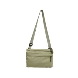 A lightweight crossbody bag in a muted beige colour with an adjustable strap and a zippered front pocket.