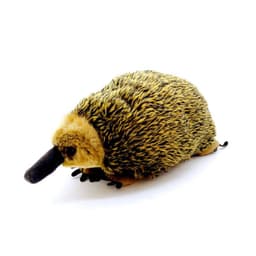A plush toy resembling an echidna, featuring yellow and brown long fur with black details and a soft texture.