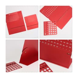 A red aluminium desk calendar featuring removable date panels and a sleek design. Includes a logo.