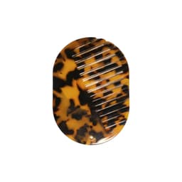 A portable acetate hair comb in tortoiseshell pattern featuring fine and wide teeth and a small circular hole for attachment.