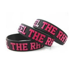 Three embossed black silicone wristbands featuring pink lettering and a logo.