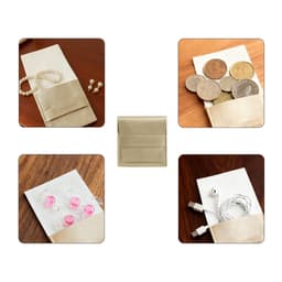 A gold PU leather flip jewelry pouch displaying various items like coins, earrings, and accessories. It features a logo.