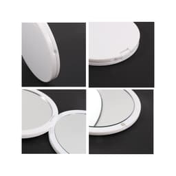 A double-sided round mirror with a white casing, featuring two reflective surfaces and a hinge for opening and closing.