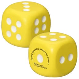 A yellow dice-shaped stress reliever with white dots and a logo on one side.