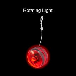 A red yoyo with a rotating light feature and a white string, displayed against a black background. It has a logo.