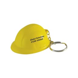 A yellow helmet stress reliever attached to a silver keyring, featuring branding on the side.