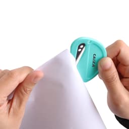 A coloured letter opener in aqua being used to open a white envelope. The opener features a logo.