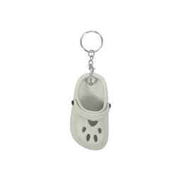 A paw shape clog shoe keyring in light grey, featuring a silver keyring attachment.