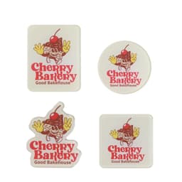 Acrylic fridge magnets in various shapes, featuring a design with a cherry and baked goods, in red and white.