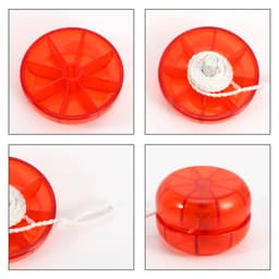 A classic yo-yo in bright red with a white string, featuring a circular design and a central axle.