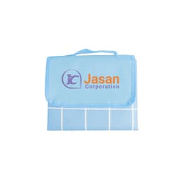 A large picnic blanket in blue featuring a grid pattern and a logo. Folds neatly with a carry handle.