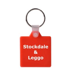 A square red hard plastic keyring with a metallic keyring attachment. It features a logo on one side.