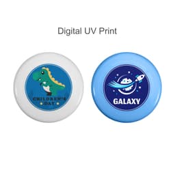 Two frisbees, one white featuring a green dinosaur, the other blue with a rocket and planet design. Both have logos.