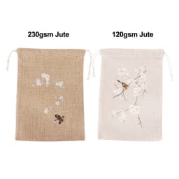 Two jute produce bags are displayed, one brown with a floral design and one cream with a butterfly and floral pattern.