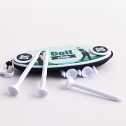 A Golf Tee Set featuring multiple white tees and a pouch with a logo, set on a light background.
