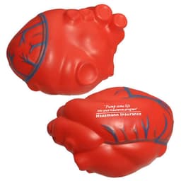 A red heart-shaped stress reliever with a textured surface and a logo on one side. It's soft and squeezable.