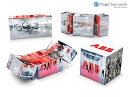 A set of cube-shaped promotional displays featuring images in silver, red, and white, with an embedded logo.