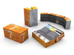 A collection of colourful packaging boxes in orange and grey, creatively arranged to showcase various designs and contents.