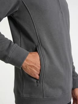 A grey men's half zip fleece jumper featuring side pockets. The fabric appears soft and lightweight.