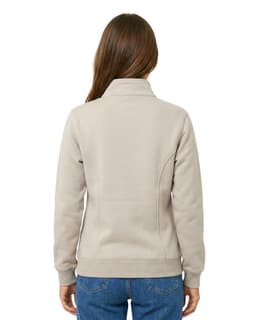 A light beige women's half zip fleece jumper, featuring a collar and fitted silhouette, viewed from the back.