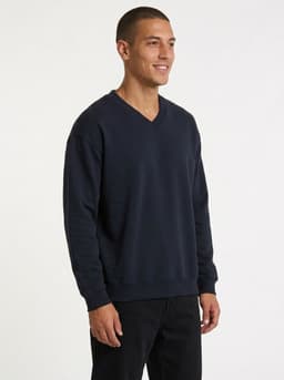A navy blue men's/unisex V-neck fleece jumper, featuring a relaxed fit and long sleeves.