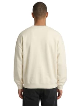 A cream-coloured oversize crew neck fleece sweater in a back view, featuring a simple design and a logo.