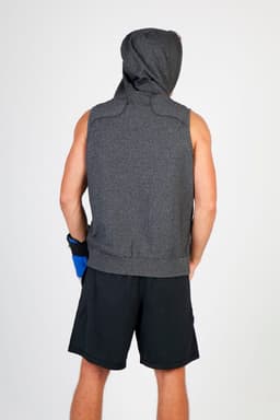 A sleeveless grey hoodie with a hood, viewed from the back, paired with black shorts. The model wears a blue glove.