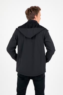 A man wearing a black soft shell hooded jacket, viewed from the back, showcasing its design and fit.