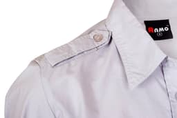 A light-coloured women's military long sleeve shirt featuring a button-up design and a shoulder button detail.