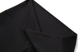 A pair of women's high-rise full-length leggings in black, featuring a smooth fabric and contoured seams.