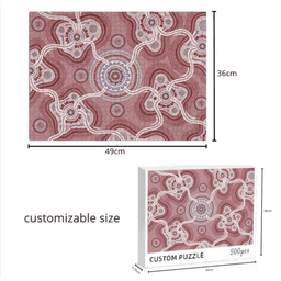 A 500-piece jigsaw puzzle with a red and white intricate design, displayed with dimensions and a boxed version.