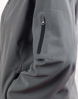 A grey softshell jacket featuring a zippered pocket on the sleeve and a sleek design.