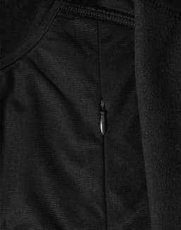 A black softshell jacket featuring a zipped pocket detail and a logo.