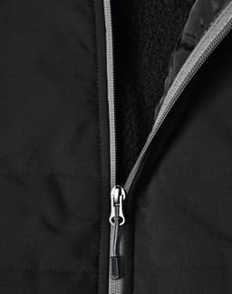 A black quilted jacket featuring a zippered closure and a soft interior lining. It has a logo on the surface.