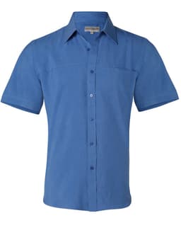 A men's short sleeve shirt in a shade of blue, featuring a button-down front and a patch pocket. It has a logo.