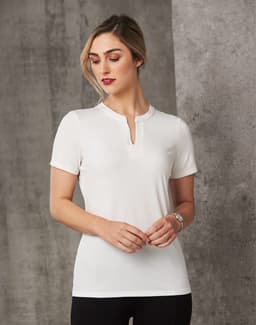 A white ladies' V-neck short sleeve knit top with a tab collar, featuring a fitted design and a subtle logo.
