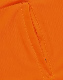 An orange polo shirt featuring a vented design and a zippered pocket. The fabric appears breathable and lightweight.