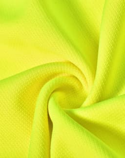 A close-up of bright yellow fabric, featuring a textured pattern, ideal for polo shirts, with a logo visible.