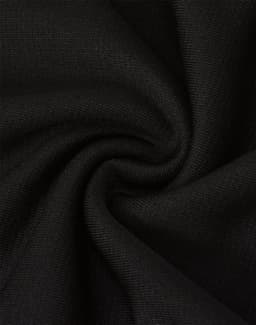 A close-up of black fabric, showcasing its texture and weave, suitable for sports shorts. Features a logo.