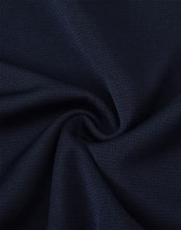A close-up of navy fabric, featuring a smooth, textured finish, suitable for adults' sports shorts.