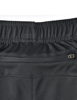 Bamboo charcoal sports shorts in black with a textured fabric and an elastic waistband featuring a zippered pocket.
