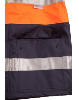 A hi-vis long line safety jacket in orange and navy, featuring reflective 3M tapes and a front pocket with buttons.