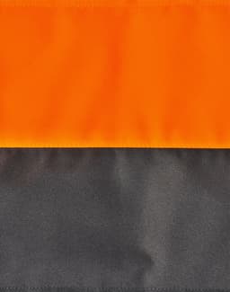 A quilted safety jacket featuring a bright orange upper section and a dark grey lower section, with a logo present.