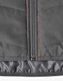 A grey quilted safety jacket with orange stitching, featuring a zip closure and a lining for added warmth.