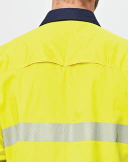 A high-visibility yellow long-sleeve shirt with segmented reflective tape on the back and a navy collar.