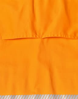 An orange long-sleeve safety shirt featuring segmented reflective tape and a logo.